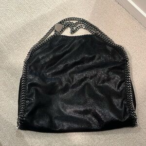 Barely used Stella McCartney bag, shiny black with silver hardware.